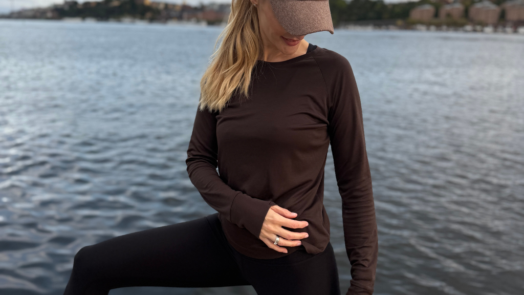 Woman working out outdoors wearing Tripulse natural fibre activewear