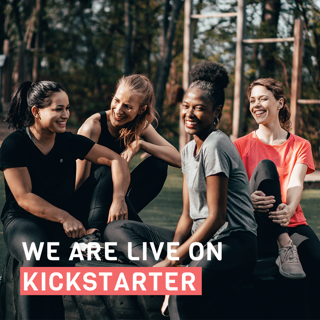 Four women laughing together outdoors in activewear with the caption We Are Live On Kickstarter.