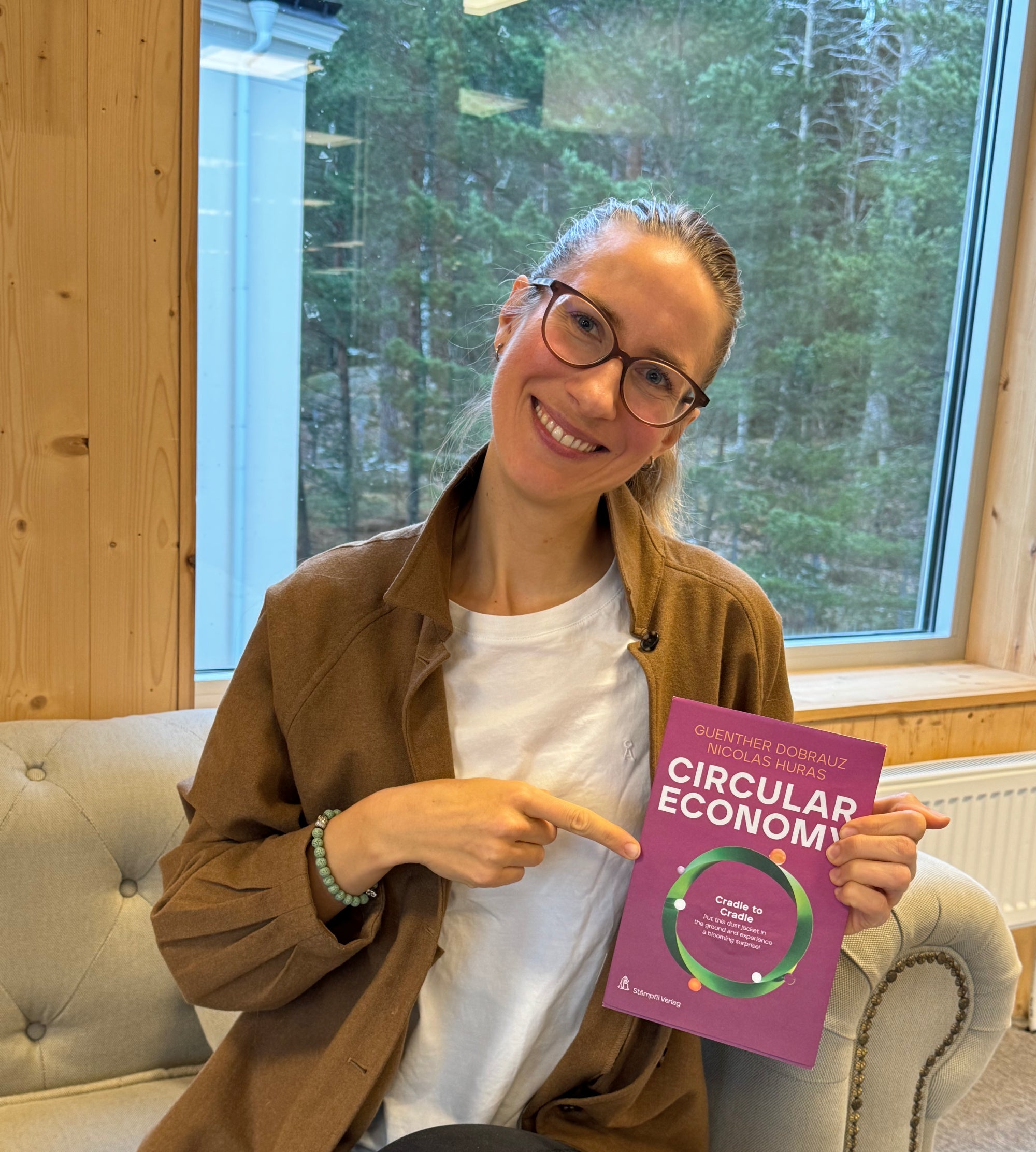 Franziska Mesche pointing at the Circular Economy book featuring her contribution.