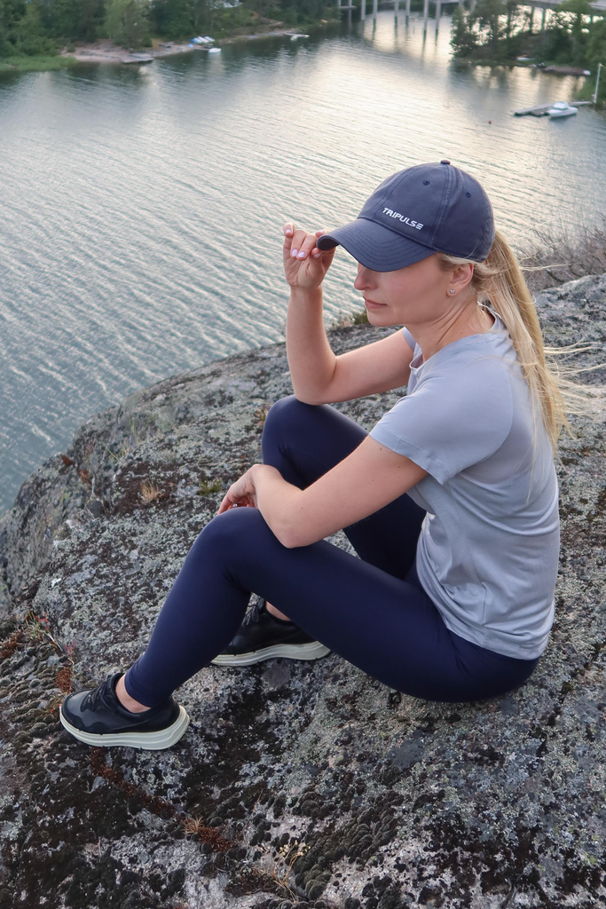 Woman wearing tripulse tencel tshirt, leggings and cap
